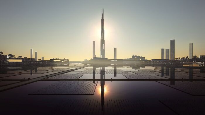 Futuristic cityscape with tall skyscrapers at sunset, reflecting in water, perfect for exploring cool Wikipedia articles.