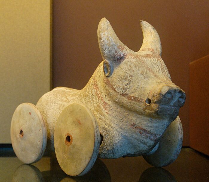 Clay ox figurine on wheels, an example of cool historical artifacts featured in interesting Wikipedia articles.