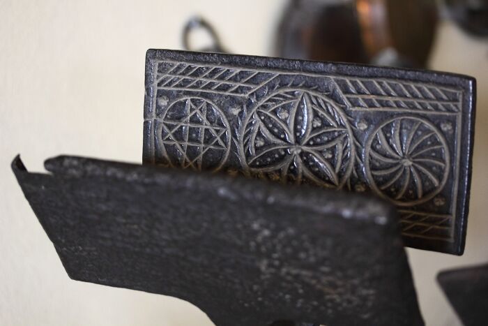 Intricate design on a vintage metal object, showcasing cool patterns and textures for curious readers.