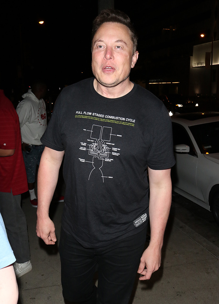 A person in a black shirt on a nighttime street, connected to the debate over changing beauty standards with Ozempic use.