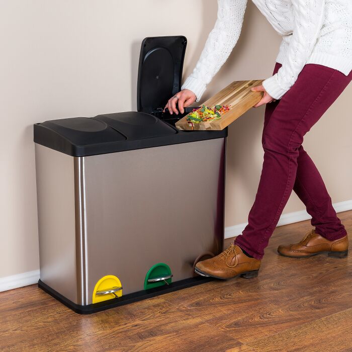 Person using a divided trash bin for an effective cleaning hack.