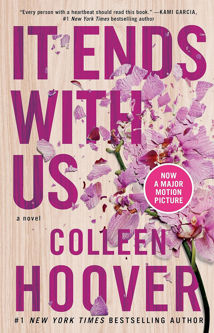 Cover of “It Ends with Us” by Colleen Hoover, featuring pink flowers, related to books people judge.