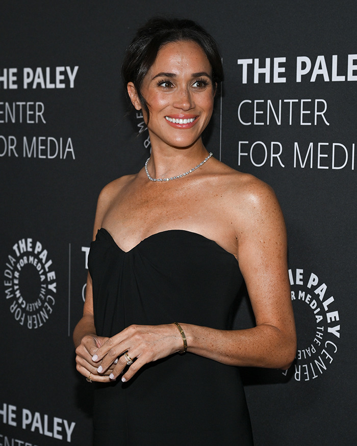 Woman in a black dress at The Paley Center event, related to controversies surrounding a show.