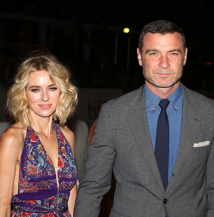 Naomi Watts and companion in formal attire at an event, highlighting Paris Fashion Week debut context.