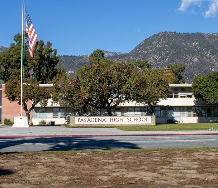 Pasadena High School with mountains in the background, related to Steve Carell helping teen victims.