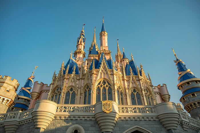 Cinderella Castle under a clear blue sky, representing nostalgic Disney movies.