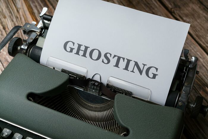 Typewriter with paper showing the word &ldquo;GHOSTING,&rdquo; illustrating a cool Wikipedia article concept to explore.