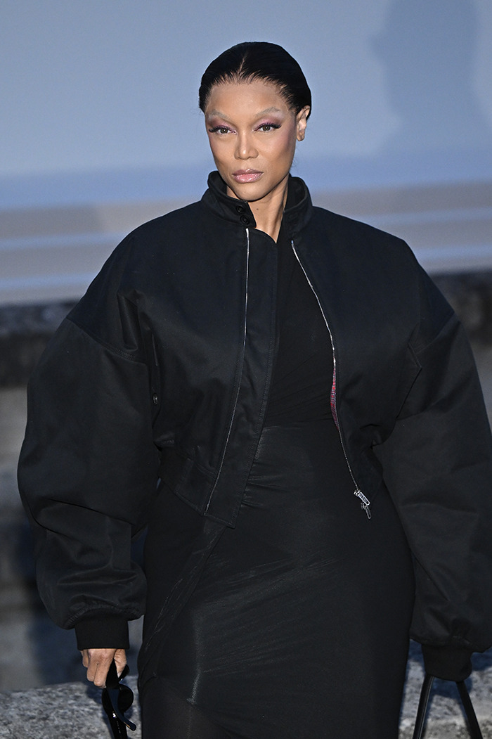 Model in black jacket at Paris Fashion Week.